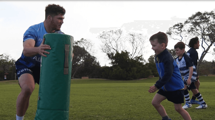 Carlo Tizzano's tackle training with Joondalup Brothers Under-8s