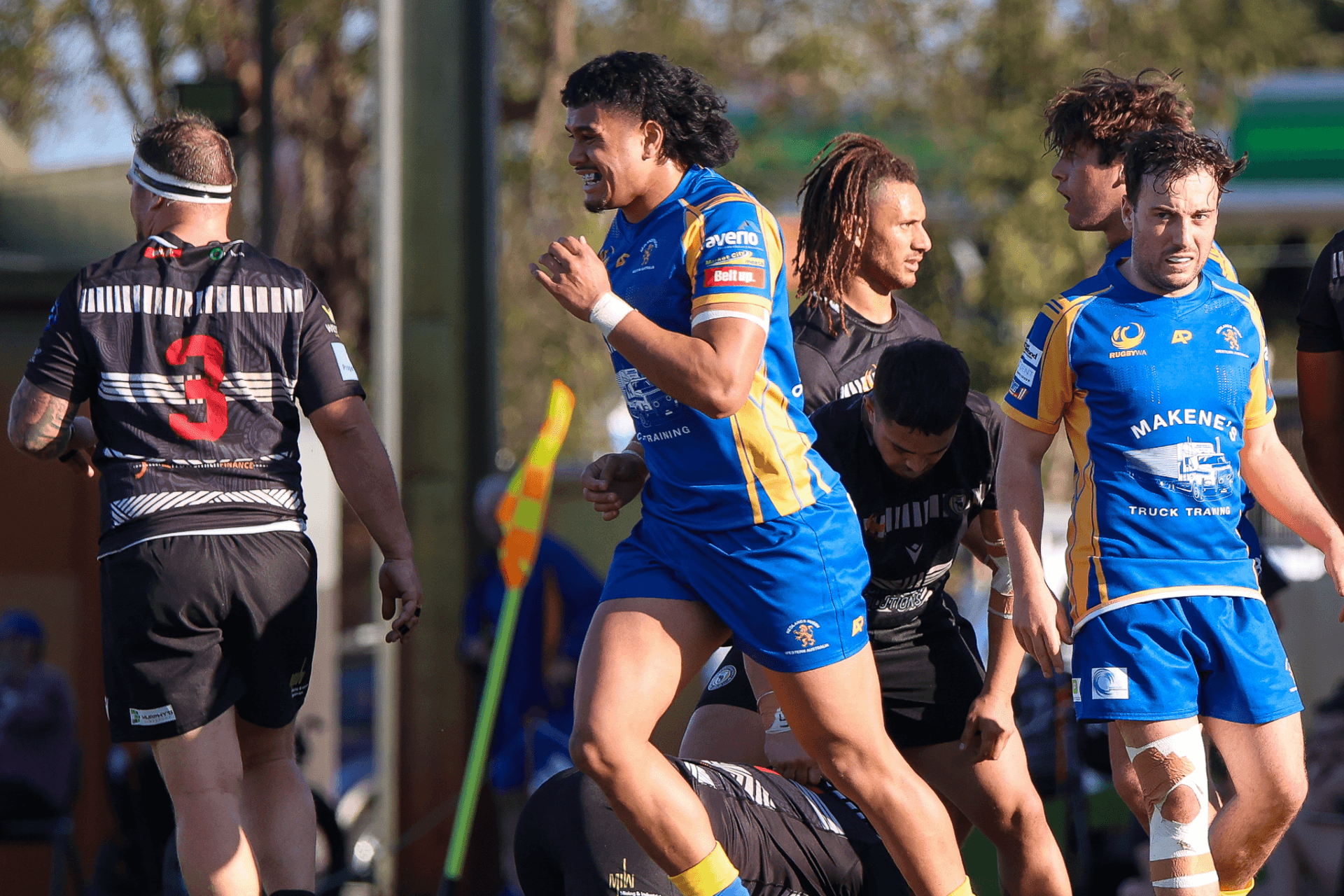 Divad Palu in action for Nedlands, with Baysie's Issak Fines-Leleiwasa in the background. Photo credit: Amy Winter
